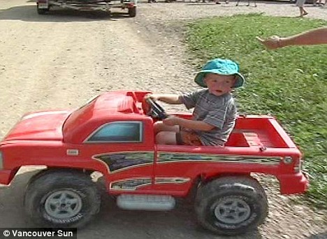Lucky boy: Demetrius Jones, three, in his beloved toy truck